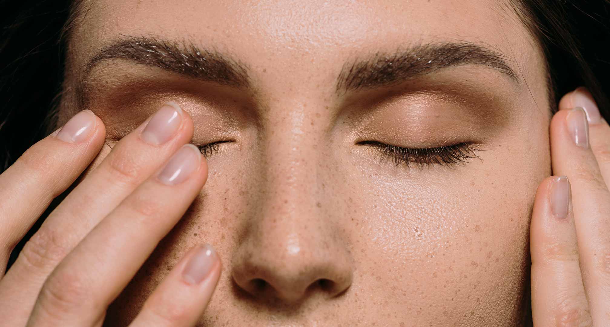 Woman trying to remove stuck contact lens